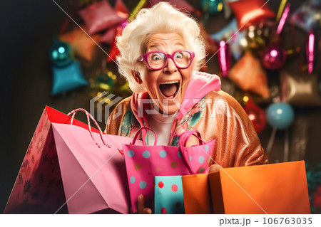 Happy older woman shouts joyfully and holds shopping bags. Concept of shopping, sales season, Black Friday 106763035
