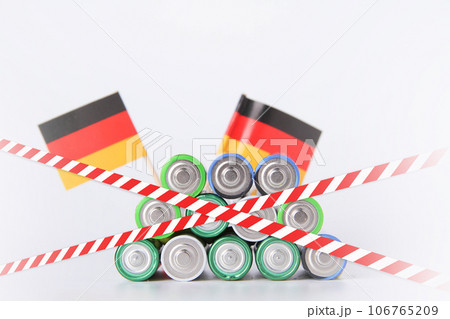 Battery. A lot of batteries on the background of the flag of the country. Battery. A lot of batteries on the background of the flag of the country. 106765209