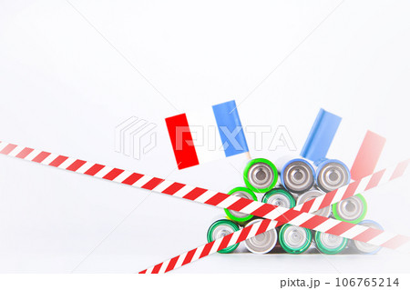 Battery. A lot of batteries on the background of the flag of the country. 106765214