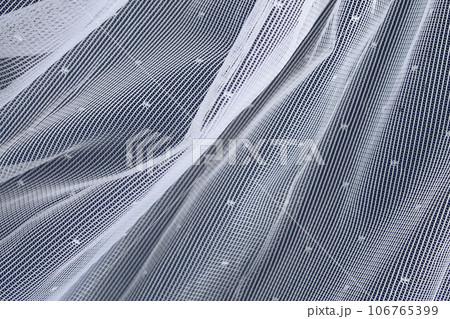 White artistic embroidery in lace style. Close-up. White artistic embroidery in lace style. Close-up. 106765399