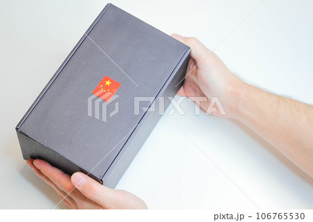 Post from China. Receiving a parcel. Box with the Chinese flag. 106765530