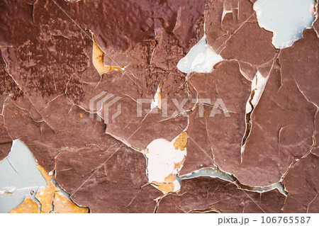 Cracked paint texture. Grunge wall texture. Dark wall with old paint Cracked paint texture. Grunge wall texture. Dark wall with old paint 106765587