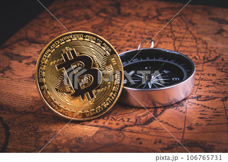 Compass and bitcoin. Travel and cryptocurrencies. Buying tickets with bitcoins. 106765731