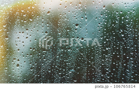 Sun after rain. Drops on glass. It's been raining. Texture on glass. 106765814