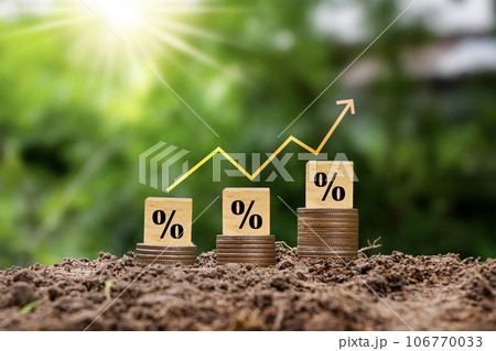 Percentage sign on wooden cube and red arrow. Idea for FED considering raising interest rates. World economy 106770033
