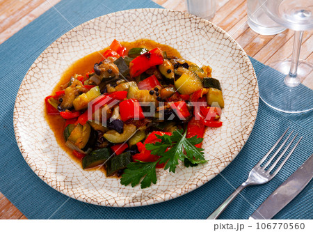 Healthy vegetarian dinner, braised vegetables on plate Healthy vegetarian dinner, braised vegetables on plate 106770560