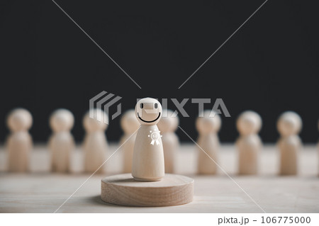 Selecting a wooden figure with a happy face for success. Customer service rating, feedback, and satisfaction survey. HR management choosing a positive leader for the team. Human Resource Management Selecting a wooden figure with a happy face for success. Customer service rating, feedback, and satisfaction survey. HR management choosing a positive leader for the team. Human Resource Management 106775000