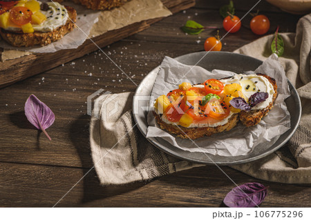 Italian bruschetta with roasted tomatoes Italian bruschetta with roasted tomatoes 106775296