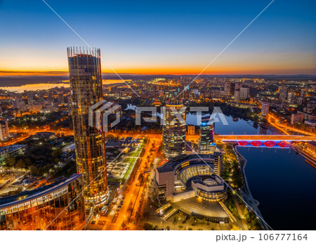 Yekaterinburg city and pond aerial panoramic view at summer or early autumn night. Night city in the early autumn or summer. 106777164