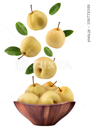 Fresh Chinese pear in a wooden bowl on a white background. Fresh Chinese pear in a wooden bowl on a white background. 106778386