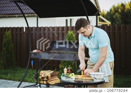 Man makes healthy food on backyard 106779284