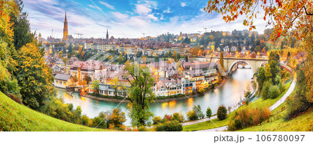 Amazing autumn view of Bern city on Aare river during evening with Pont de Nydegg bridge , cathedral of Bern and Nydeggkirche - Protestant church. Amazing autumn view of Bern city on Aare river during evening with Pont de Nydegg bridge , cathedral of Bern and Nydeggkirche - Protestant church. 106780097