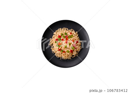 Delicious fresh noodles with sweet pepper, tomato, spices and herbs Delicious fresh noodles with sweet pepper, tomato, spices and herbs 106783412
