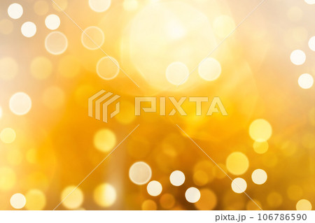 Bright yellow defocused light background for Christmas. Lens flare from bright light. 106786590