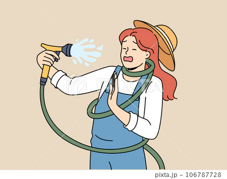 Clumsy woman with garden hose accidentally sprays herself with water while watering backyard lawn Clumsy woman with garden hose accidentally sprays herself with water while watering backyard lawn 106787728