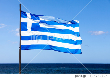 Greek flag waving in mid air 106789597