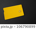 Green plastic bank card on a gray background. Mockup. Plastic card with chip. 106790899