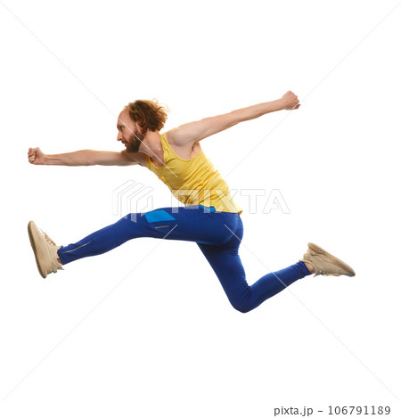 Young man in sportswear running in a jump isolated on white background. Overcoming difficulties. Motivation Young man in sportswear running in a jump isolated on white background. Overcoming difficulties. Motivation 106791189