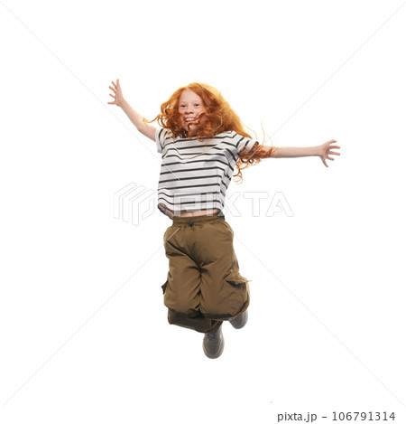 Little happy girl, child in casual clothes cheerfully jumping isolated on white background. Good mood 106791314
