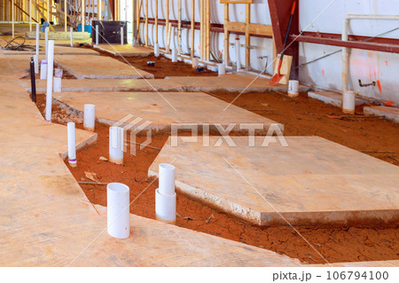 Drainage pvc pipe concrete floor reveals exposed endings for future lavatory restroom a plumbing Drainage pvc pipe concrete floor reveals exposed endings for future lavatory restroom a plumbing 106794100