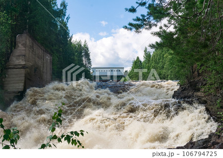waterfall during opened locks for idle discharge of water at a small hydroelectric power station waterfall during opened locks for idle discharge of water at a small hydroelectric power station 106794725