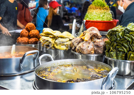 Many vietnamese snacks with boild and fried meat and soup in vietnamese night market in Da Lat 106795250