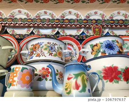 enamel saucepans plates, and pots with floral pattern enamel saucepans plates, and pots with floral pattern 106797637