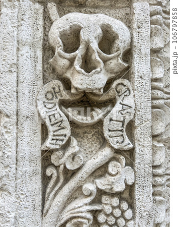 entrance of a church with holy skull sculpture in Italy entrance of a church with holy skull sculpture in Italy 106797858