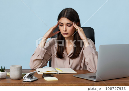 sad woman have a headache, using laptop sad woman have a headache, using laptop 106797938