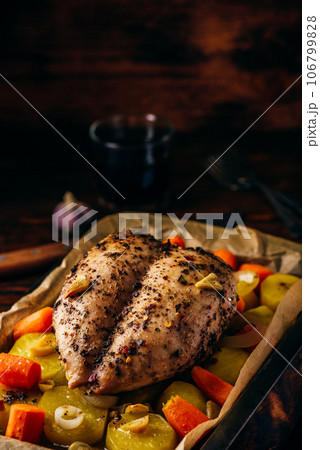 Seasoned chicken breast baked in oven 106799828