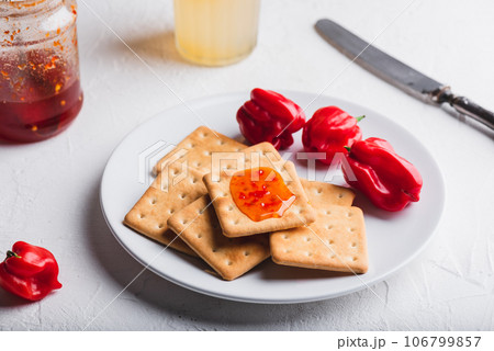 Crackers with Chili Pepper Jelly Crackers with Chili Pepper Jelly 106799857