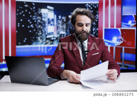 TV reporter reading headlines in newsroom and hosting night show to cover all important topics of the day, global communications. Newscaster presenting latest world and entertainment news. TV reporter reading headlines in newsroom and hosting night show to cover all important topics of the day, global communications. Newscaster presenting latest world and entertainment news. 106801275
