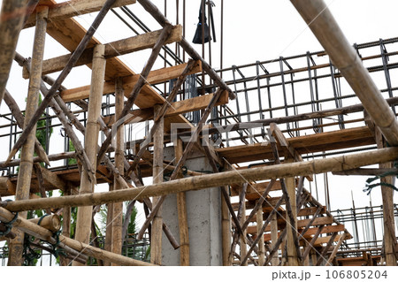 Bamboo scaffolding or crutches in traditional residential construction background 106805204
