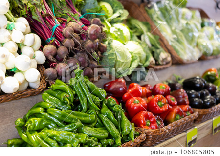 Stand of baskets full of fruits and vegetables in greengrocery Stand of baskets full of fruits and vegetables in greengrocery 106805805