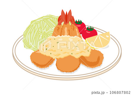 皿に乗ったタルタルソースがかかったエビフライ 106807802