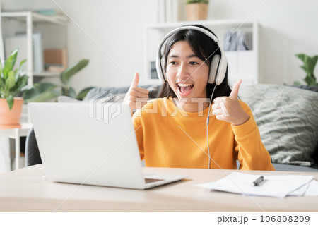 Homeschooling. Asian girl online learn video conference via internet with tutor on computer 106808209