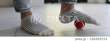 Myofascial relaxation of foot muscles with ball at home. Myofascial relaxation of foot muscles with ball at home. 106808554