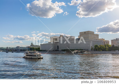 View of the Ministry of Defence of Russian Federation, and Moscow river embakment with cruise ships at sunset. View of the Ministry of Defence of Russian Federation, and Moscow river embakment with cruise ships at sunset. 106809953