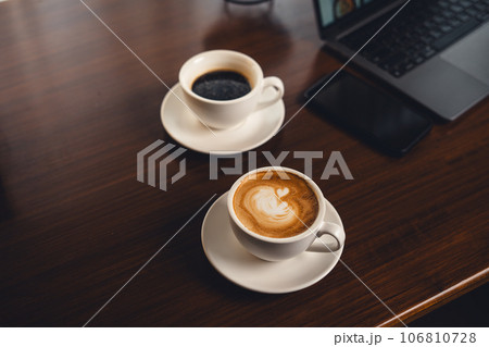 Coffee on the desk in the morning Coffee on the desk in the morning 106810728
