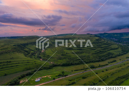 Aerial view of a storm and clouds above a village Aerial view of a storm and clouds above a village 106810754