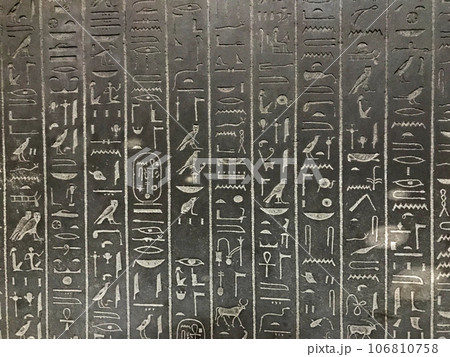 Egyptian hieroglyphs carved in stone background 106810758