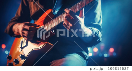 Guitar player - hands ang guitar close-up. 106815687