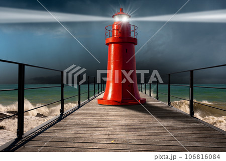 Red Lighthouse on a Wooden Pier with Rough Sea on Background Red Lighthouse on a Wooden Pier with Rough Sea on Background 106816084