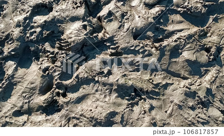Footprint or imprint shoe in the mud.Mud texture or wet brown soil as natural organic clay and geological sediment mixture as in roughing it in a dirty muddy country ground after the rain or rainy. 106817857
