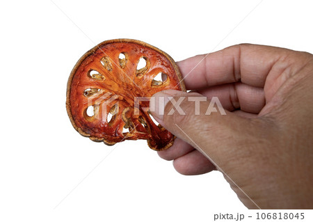 Bael is cut into slices for making healthy tea. 106818045
