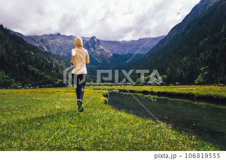 Woman trail runner cross country running in beautiful nature 106819555
