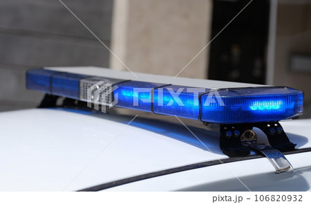 Police car with red and blue warning lights 106820932