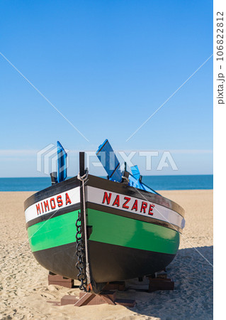 Wooden boat on the beach at Nazare, Portugal. Wooden boat on the beach at Nazare, Portugal. 106822812