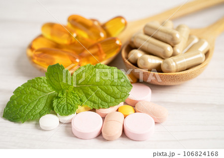 Alternative medicine herbal organic capsule with vitamin E omega 3 fish oil, mineral, drug with herbs leaf natural supplements for healthy good life. Alternative medicine herbal organic capsule with vitamin E omega 3 fish oil, mineral, drug with herbs leaf natural supplements for healthy good life. 106824168