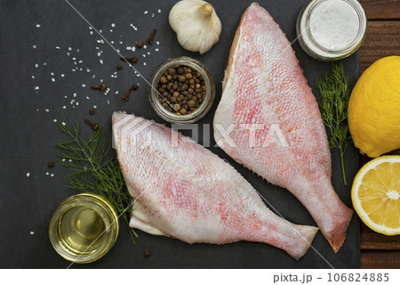 Seafood. Sea perch on a black board. Seafood. Sea perch on a black board. 106824885